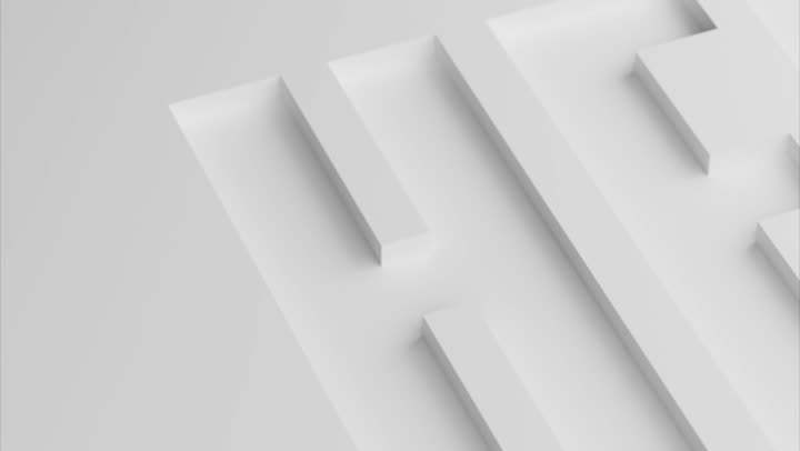 Empty white letterforms recessed into a white surface.